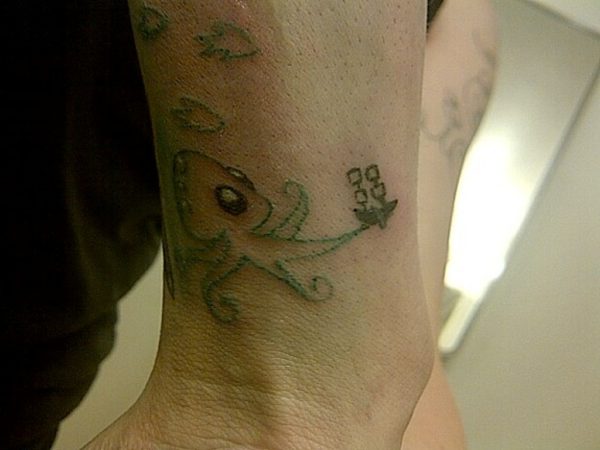 Green Octopus Tattoo On Wrist